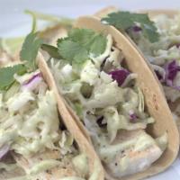 Grilled Fresh Fish Tacos (3) · Freshly caught fish, grilled and served with our house stone-ground tortillas, Cilantro, cre...