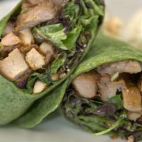 Shoyu Chicken Wrap · Marinated shoyu chicken grilled to order and wrapped with greens, feta, and mac nuts. Served...