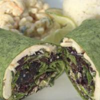 Fresh Fish Wrap · Grilled fresh fish over a bed of organic greens, feta cheese, macadamia nuts, cilantro-lime ...