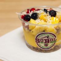 Pineapple Mango Bowl · We blend mango, pineapple and banana with coconut milk to make a thick fruit smoothie. We th...