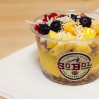 Mango-Pineapple Bowl · We blend mango, pineapple and banana with coconut milk to make a thick fruit smoothie. We th...