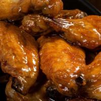 Honey Garlik Wings · Traditional bone-in wings, hand-tossed in your choice of sauce or rub. Choose your flavors!