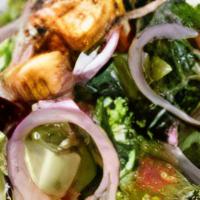 Ensalada De La Casa (V) | Havana House Salad · Mixed greens, tomatoes, red onion & Cuban croutons, tossed in a roasted garlic vinaigrette.