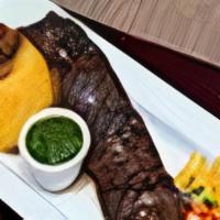 Churrasco A La Parrilla | Grilled Skirt Steak · Center-cut skirt steak, grilled to order. Served with crispy onions, pineapple salsita & chi...