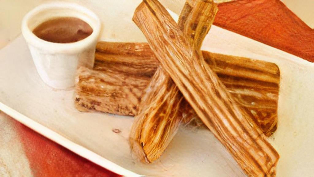 Churros | Latin Donut Sticks · Traditional Latin donut sticks served with dulce de leche and chocolate dipping sauces.