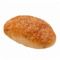 大雜量飽 Multigrain Flax Loaf · A loaf of multigrain bread made with whole wheat, flax seeds, and raisins.