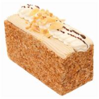 長咖啡 Coffee Cake · Coffee sponge cake layered with coffee buttercream and topped with vanilla buttercream and t...