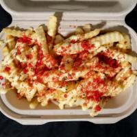Mauna Fries · Crisp fries topped with mustard Mayo sauce, black lava salt and hot Cheeto dust.