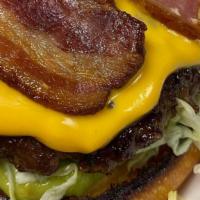 The Animal Burger · 5 oz. angus beef patty with lettuce, tomato, onions, pickles, sliced avocado, bacon, house-m...