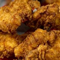 Buttermilk Chicken Tenders · Four pieces crunchy white meat chicken tenders served with choice of our house-made wings sa...
