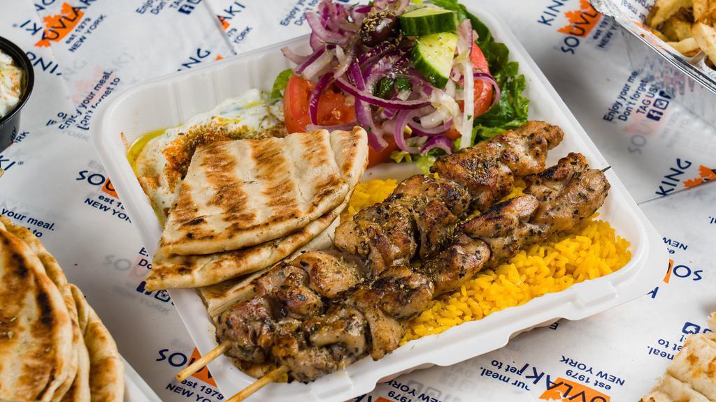 Chicken Souvlaki Platter · Two sticks of our hand skewered chicken souvlaki over our handcut fries or yellow rice.
Comes with a side salad and your choice of bread, sauce, and toppings.