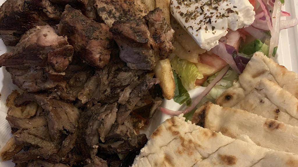 Lamb & Beef Gyro Platter · Double portion of our slow roasted, hand-stacked lamb and beef gyro over our Hand Cut fries or yellow rice.
comes with a side salad and your choice of bread, sauce, and toppings.