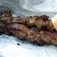 Pork Souvlaki · Marinated and hand skewered pork on a stick, grilled over a hardwood charcoal grill. Served ...