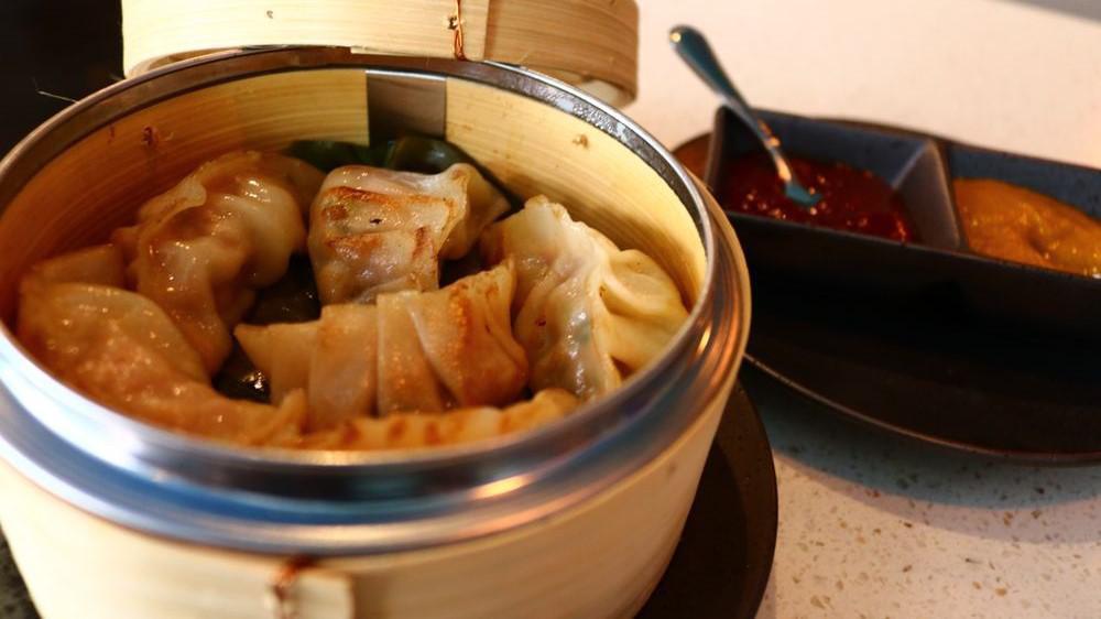 Chicken Dumplings (Pan Fried Or Steamed) · Served with special sesame and chili sauce.