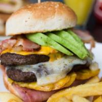 Floridita Deluxe Burger · Double meat, Swiss and American cheese, ham, bacon, avocado, fried plantains and pickles.