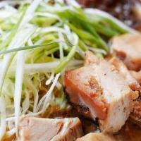 Miso Ramen · Vegan miso broth, braised chicken, wood ear mushrooms, cabbage, and green onions.