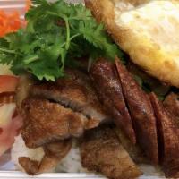 Triple Delight Com Dia · Served with fried Asian sausage, fried egg, pork chop, pickled carrots and radish, cucumber,...