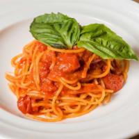 Spaghetti All Chitarra · Hand cut spaghetti with cherry tomatoes, and basil sauce.