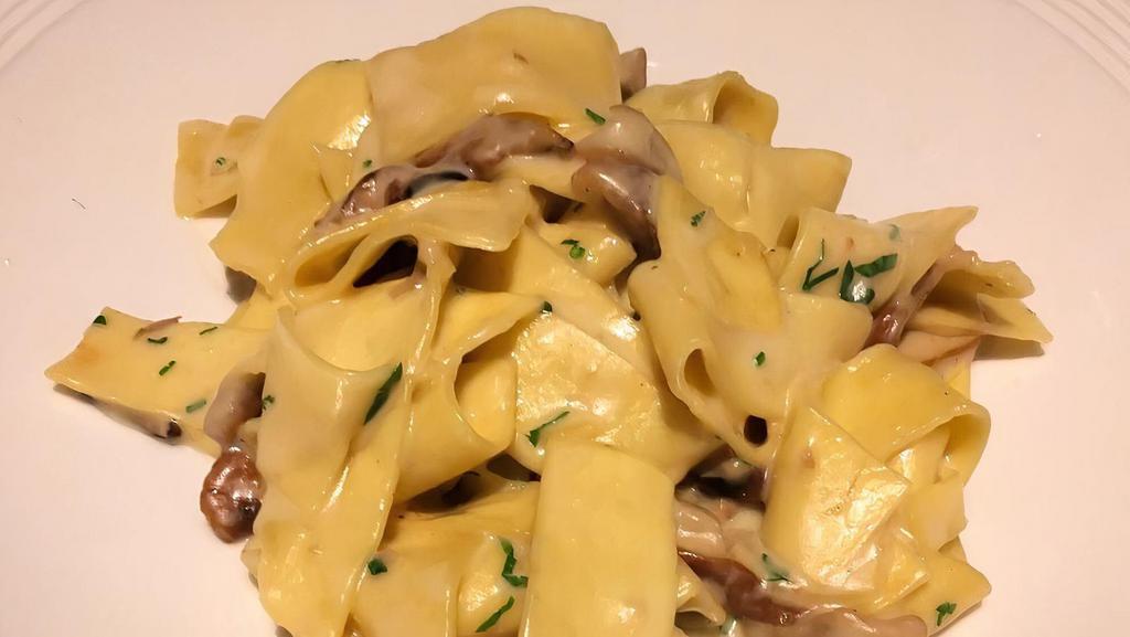 Pappardelle · Fresh porcini mushroom and melted pecorino cheese.