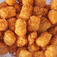 Original Tiger Tots · A large basket of Tiger Tots topped with our secret blend of spices.