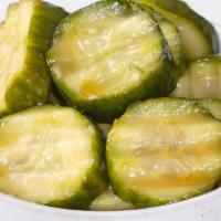 Housemade Sesame Pickles (12 Oz. Serving) · Persian cucumber slices pickled in a blend of Asian oils, vinegars and seasonings.