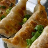 Chicken Pot Stickers · Asian Dumpling Pan-Fried in the Classic Tradition 
Served with Sweet Soy Sauce