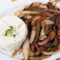 Lomo Saltado De Carne · Chunks of beef with onions, tomatoes and French fries.