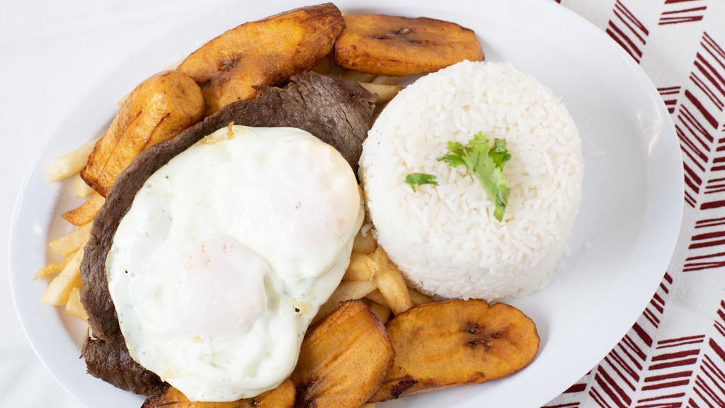 Bistec A Lo Pobre · Beef steak, French fries, two fried eggs and sweet plantains.