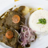 Seco De Res · Stew beef chunks with rice and beans.