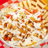 Chicken Platter · Favorite. Served with rice, lettuce, tomato, onion with pita slices and white sauce.