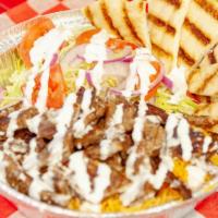Gyro Platter · Served with rice, lettuce, tomato, onion with pita slices and white sauce.