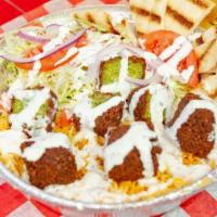 Falafel Platter · Served with rice, lettuce, tomato, onion with pita slices and white sauce.