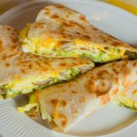 Wild West Breakfast · Quesadilla stuffed with eggs, jalapenos, sausage, and cheddar cheese. Comes with Guacamole a...