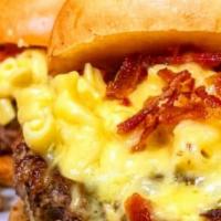 Mac And Cheese Burger · We suggest our beef burger. Topped with truffle mac and cheese, chopped bacon, cheddar and o...