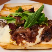 Grilled Skirt Steak Sandwich · Comes with caramelized onions, mozzarella cheese and truffle mayo on a toasted panini. Serve...