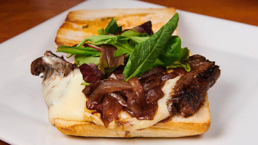 Grilled Skirt Steak Sandwich · Comes with caramelized onions, mozzarella cheese and truffle mayo on a toasted panini. Served with choice of side.