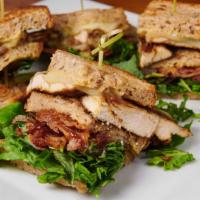 Chicken Club Sandwich · Bacon, sun-dried tomato, honey mustard, Mesclun greens on a toasted whole grain. Served with...