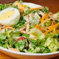 Jackson Hole Cobb Salad · Romaine lettuce, cheddar cheese, mozzarella cheese, sliced egg, chopped bacon, onions, tomat...