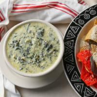 Spinach & Artichoke Dip · Spinach, artichoke hearts, garlic and creamy cheeses served with tortilla chips.