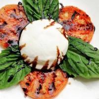 Homemade Burrata · Made in house served with pesto, roasted tomato, fresh basil