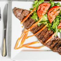 Churrasco · Grilled skirt steak. Served with choice of side.