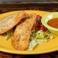 Empanadas · Beef empanadas (two) - spiced beef filled fried pastry chipotle tomato salsa.