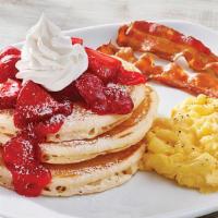 Fresh Strawberry Buttermilk Pancake Platter · Three of our famous buttermilk pancakes topped with fresh glazed strawberries, powdered suga...