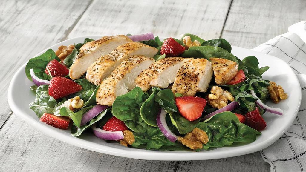 Fresh Strawberry, Walnut & Grilled Chicken Salad · Garden fresh spinach with grilled chicken, fresh strawberries, red onions and candied walnuts. Served with our house Strawberry Vinaigrette.
