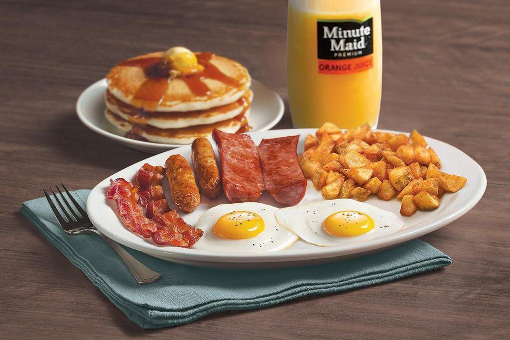 Hearty Man'S Combo · Two eggs, smoked sausage, two Applewood smoked bacon strips and two sausage links. Served with crispy hash browns or breakfast potatoes and choice of three buttermilk pancakes, fresh baked Mammoth Muffin® or buttered toast. Served with orange juice or choice of beverage..