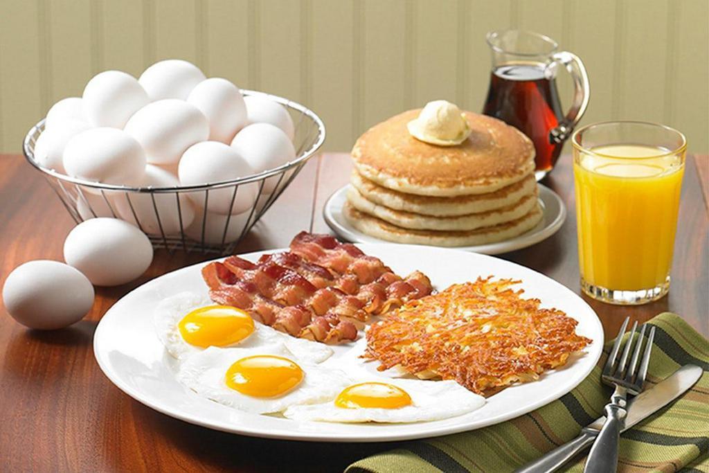 Tremendous Twelve®  · Three eggs, four buttermilk pancakes, choice of hash browns or breakfast potatoes and choice of four Applewood smoked bacon strips or four sausage links. Served with orange juice or choice of beverage..