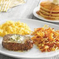Top Sirloin Steak & Eggs · USDA Choice 6 oz. grilled Top Sirloin steak*, topped with garlic butter and served with two ...
