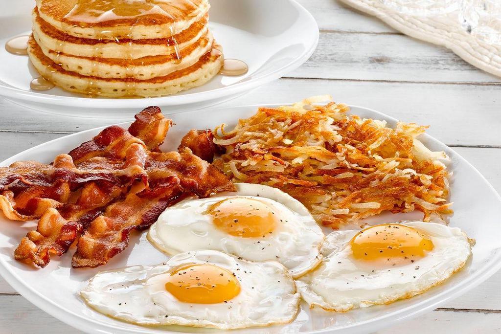 Tremendous Twelve®  · Three eggs*, four buttermilk pancakes, choice of crispy hash browns or breakfast potatoes and choice of four Applewood smoked bacon strips or four sausage links. .