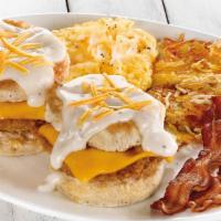 Southern Fried Chicken Biscuit Breakfast · A fried chicken fillet and Cheddar cheese inside two fresh baked biscuits.  Topped with Amer...