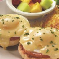 Classic Eggs Benedict · The tried-and-true favorite. Two basted eggs*, grilled ham and creamy hollandaise atop an En...
